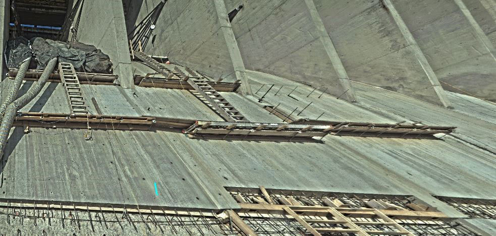 The new spillway surface will increase the efficiency of the water flow.