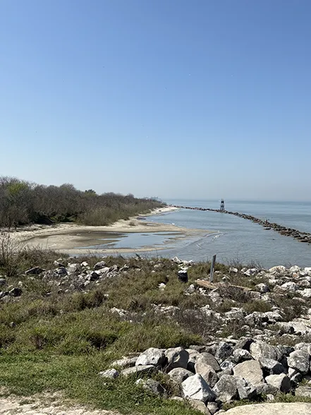 Our firm is working on a project along Coastal Texas to design and construct rock sill revetments to mitigate storms. Pictured is an example of a rock sill revetment in Galveston along the Houston Ship Channel.