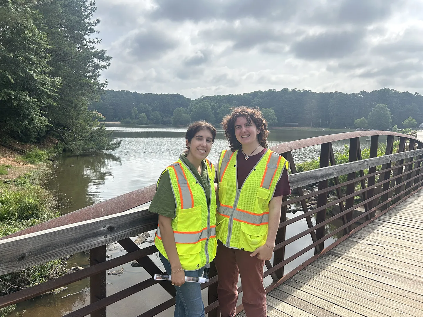Interns Caroline Krall and Simrill Smith take a picture during a dam inspection near the Atlanta, Georgia, office.