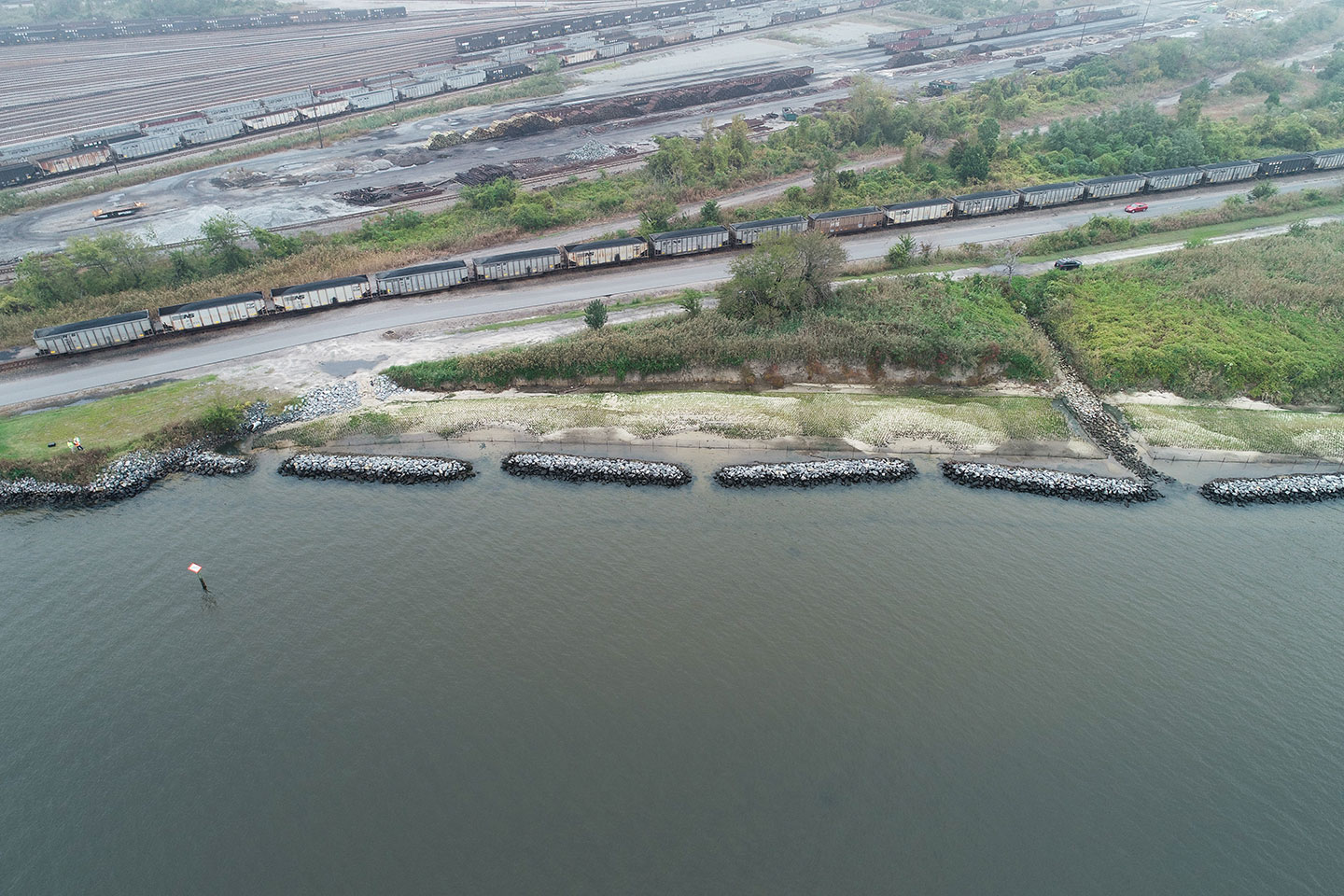 Norfolk Sothern’s railway can be seen in this photo, as well as an important roadway. Without implementing the living shoreline measures, the roadway and track system were left open to flooding vulnerabilities.