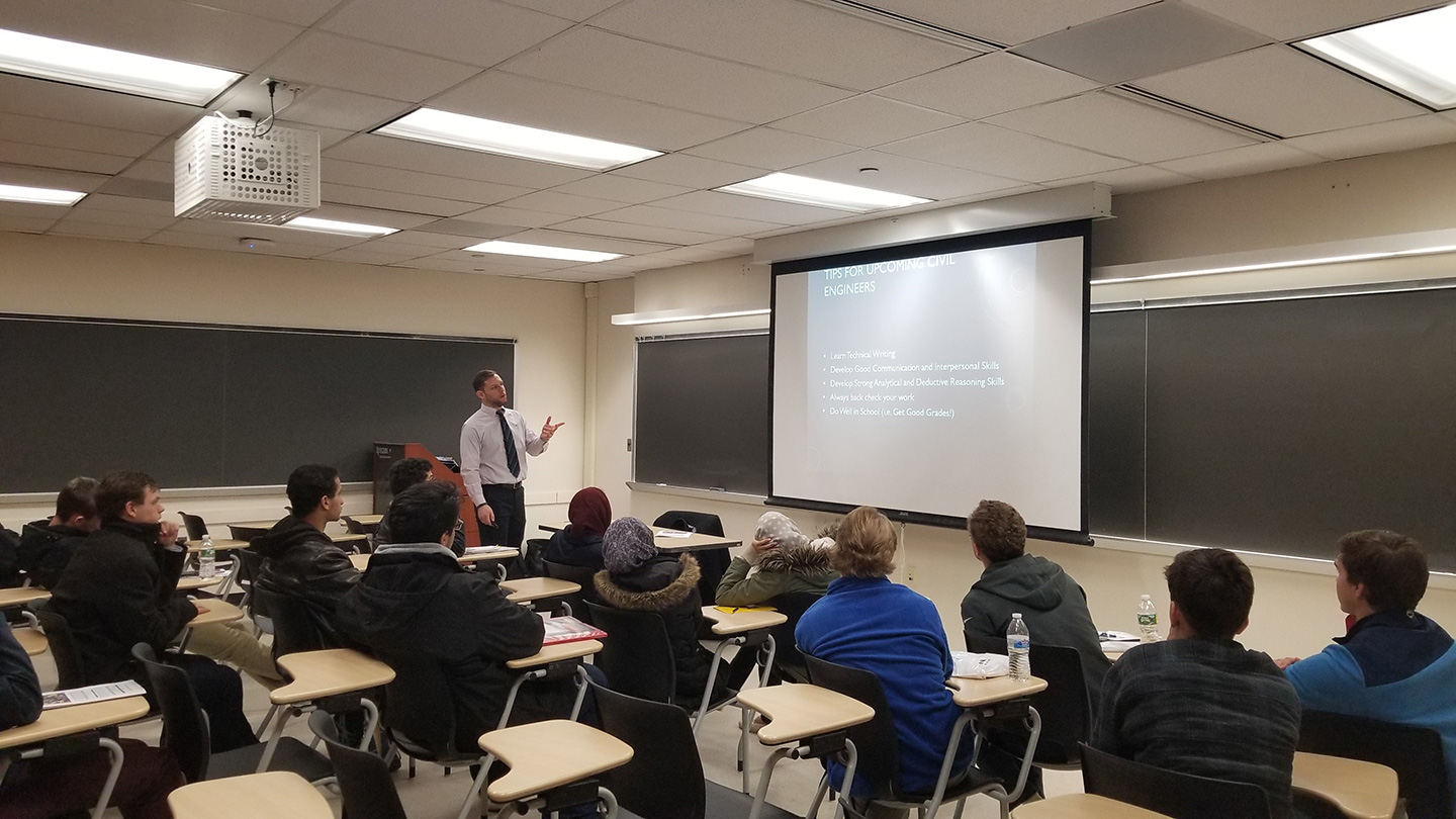 This is a picture of Matthew Alboum speaking to high school students at engineering career day. 