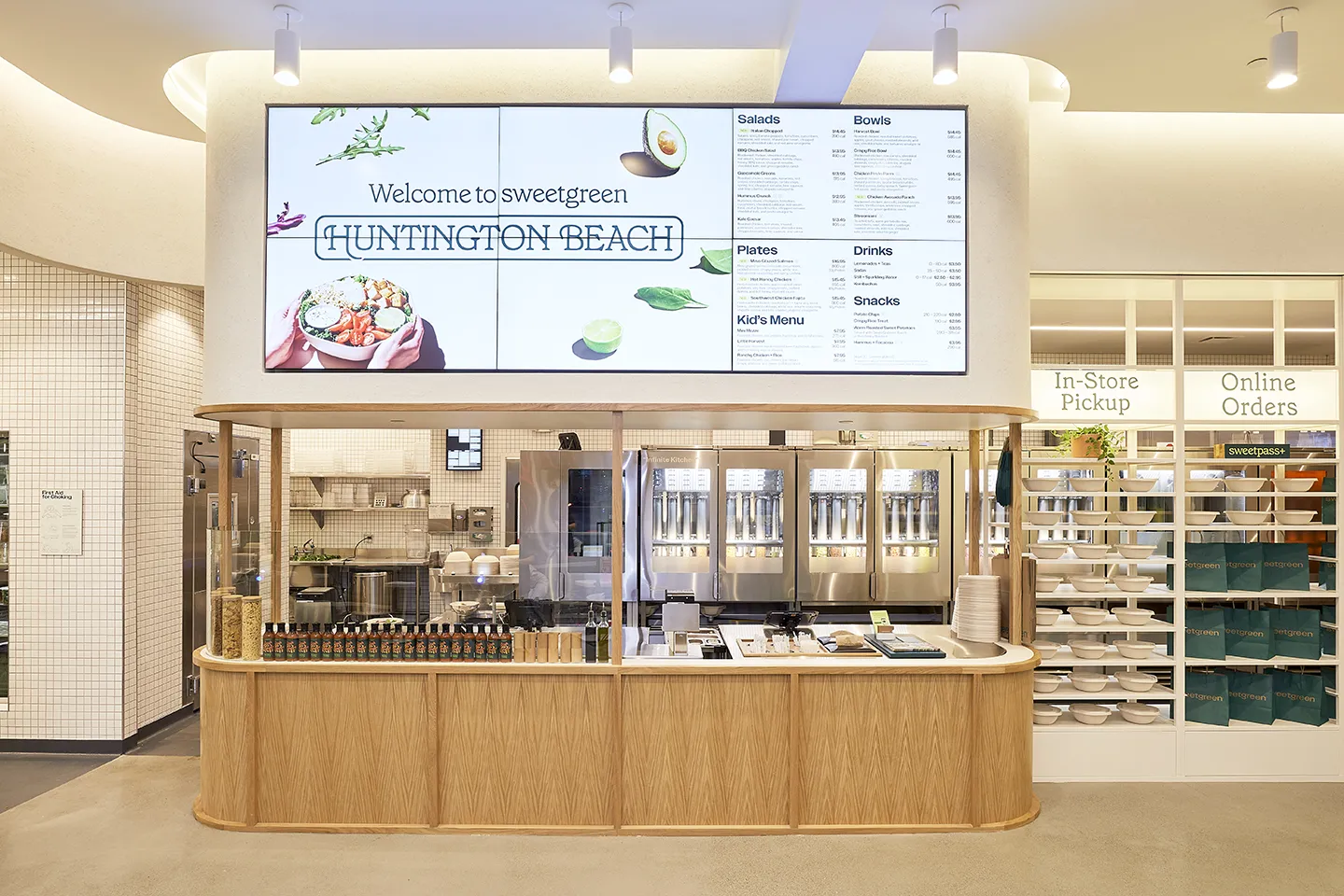 Sweetgreen branding is incorporated into every piece of the store, contributing to a welcoming environment.