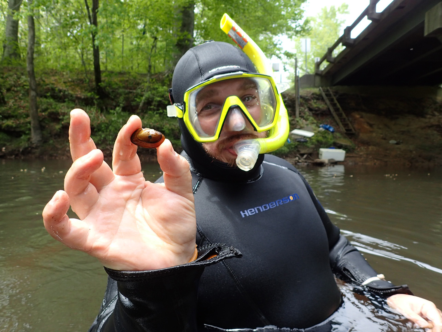 Me holding a recaptured, federally endangered Tar River Spinymussel during a mussel survey.