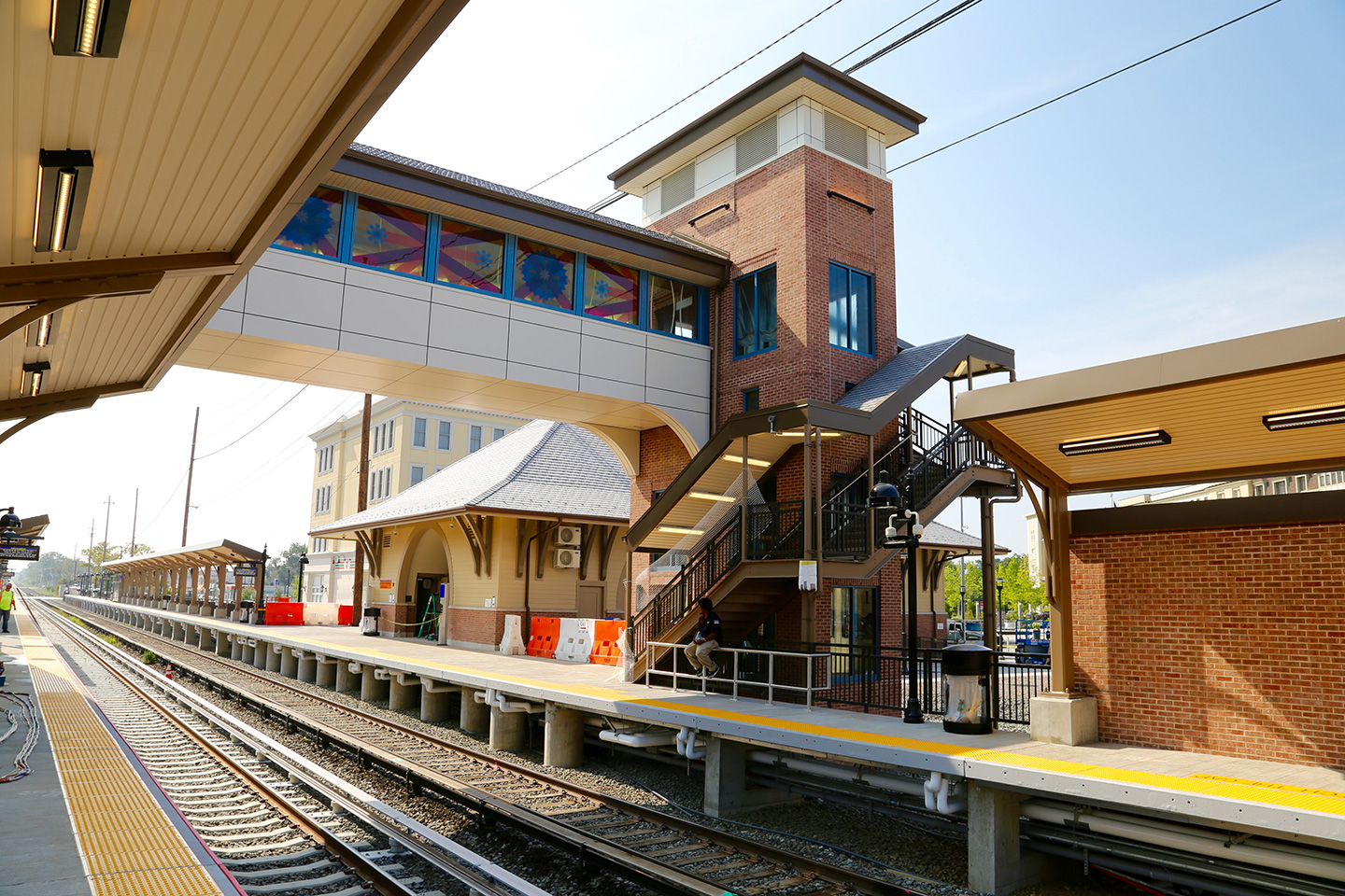 The new Wyandanch Station, a successful design-build project for the Long Island Rail Road, features lively public art along the enclosed pedestrian bridge. 