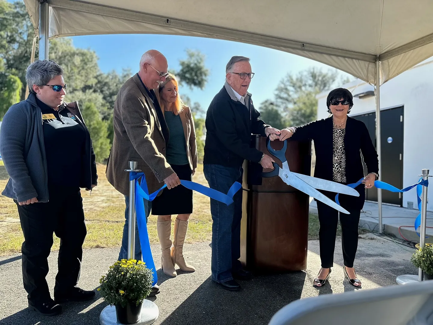 Polk County Commission Chairman George Lindsey and Resource Management Division Director of the Southwest Florida Water Management District Jennette Seachrist mark the opening of the direct potable reuse pilot with a ribbon cutting.