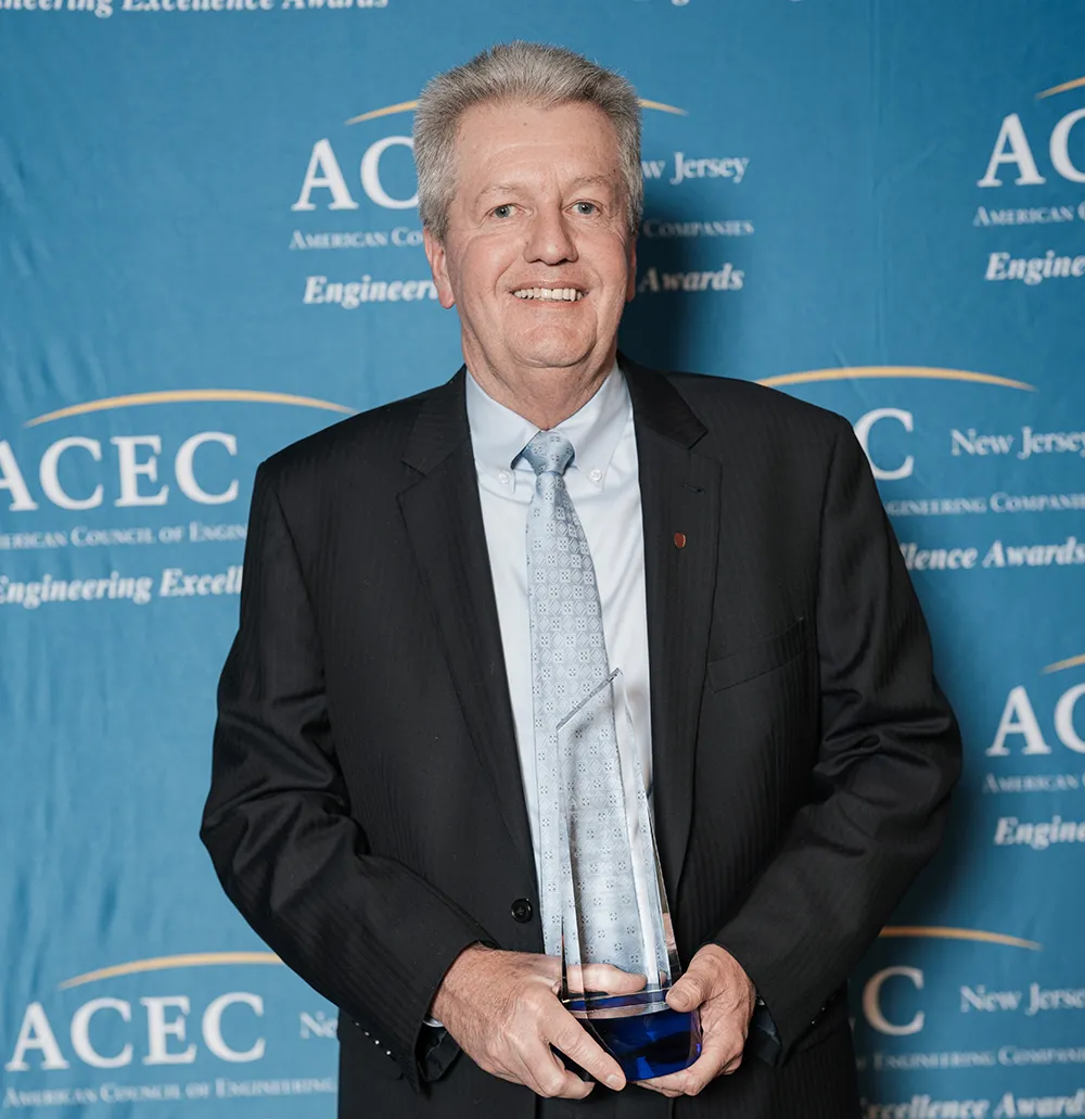 Craig R. Johnson receiving ACENJ’s Lifetime Achievement Award.