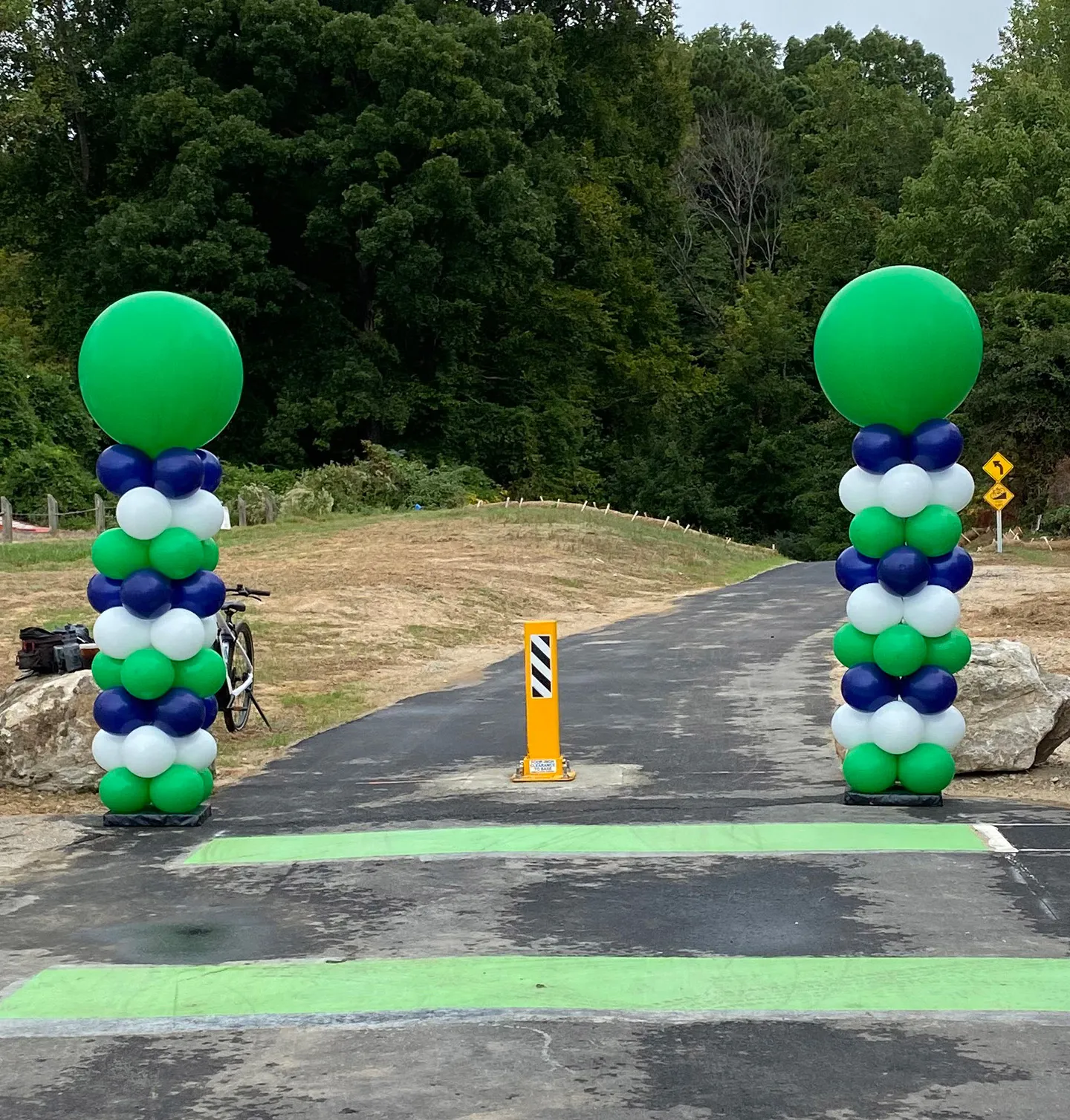 The new 10-foot-wide asphalt section of the greenway trail includes dual 7-foot by 5-foot concrete box culverts.