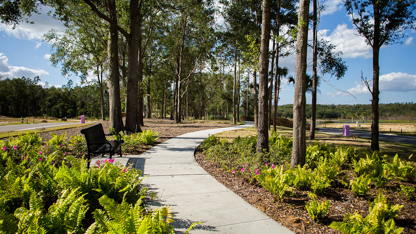 One of the many features of this single-family neighborhood is a walking trail around Lake Sims. 