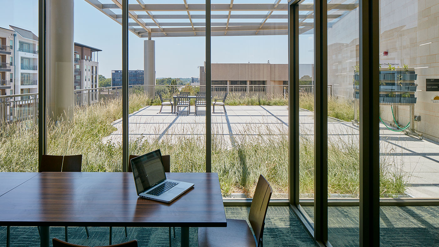 Two green roof gardens flank the second story and help the building meet its sustainable and efficiency goals. 
