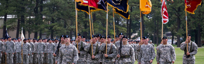 Cullen-Colorgaurd Maj. Cullen Jones pictured front. Marches the unit colors forward for the 2nd Brigade Combat Team (STRIKE) Change of Command Ceremony, Fort Campbell, Kentucky, June 26, 2015.