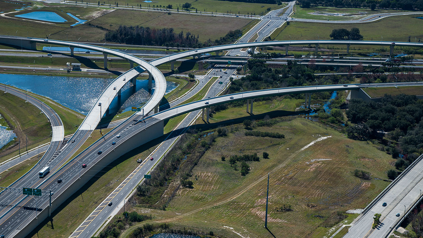 The design included three precast, post-tensioned curved concrete U-beam bridges, the first of their kind in Florida, and a curved steel bridge.