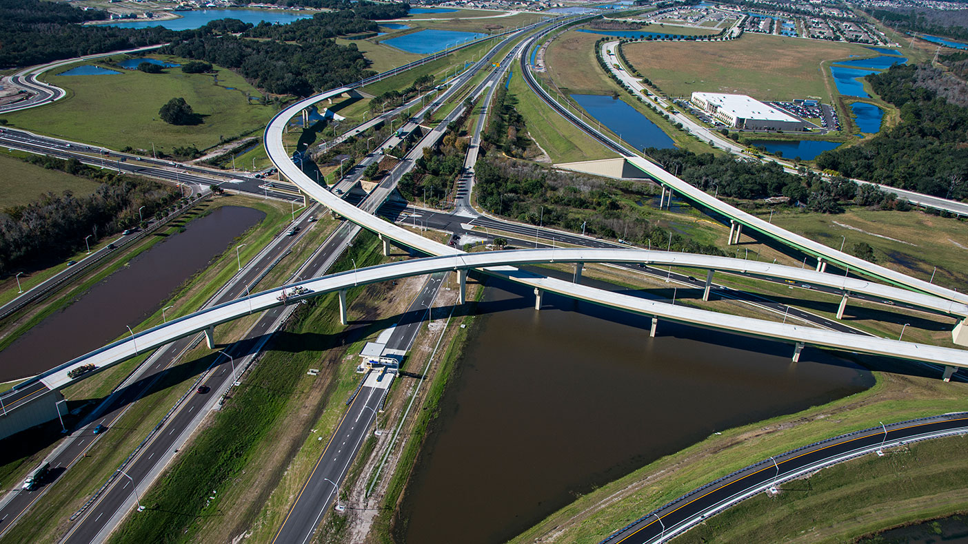 The post-tensioned precast curved concrete U-beam bridge design reduced initial construction costs and anticipated future maintenance needs.