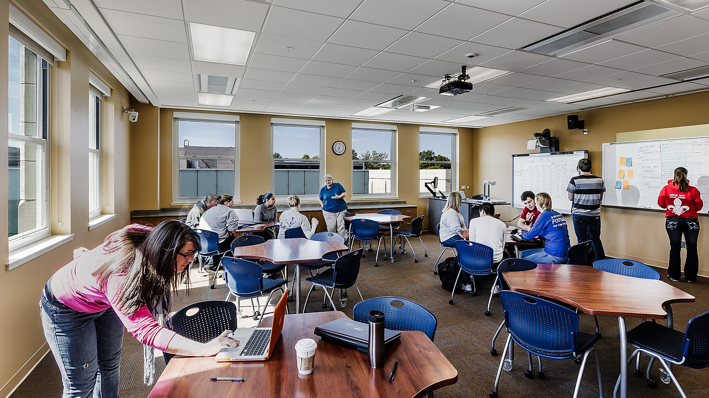 Flexible seating like backpack/book storage and large, adjustable work surfaces in the media classroom can be reconfigured (photo courtesy Mark Ballogg).
