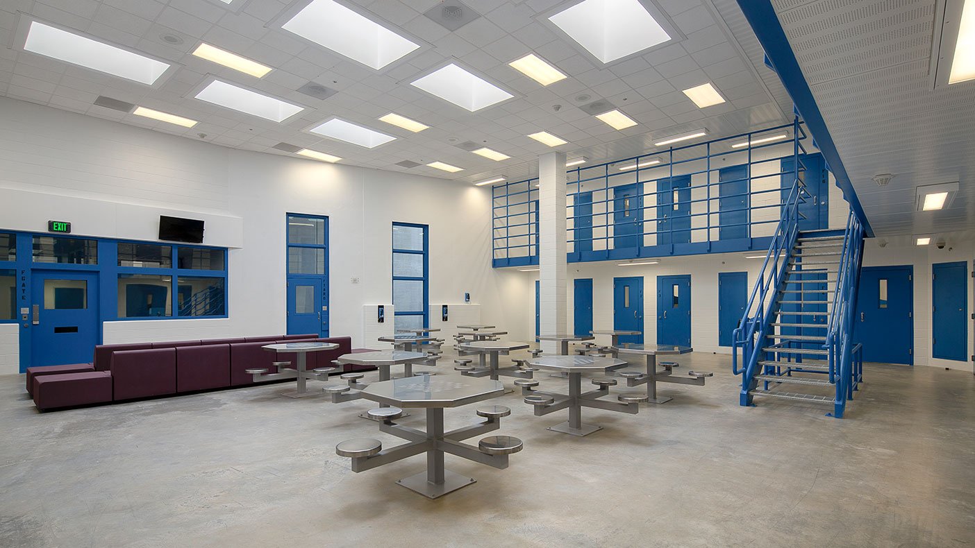 The dayroom is a multi-purpose space with a decentralized inmate program.