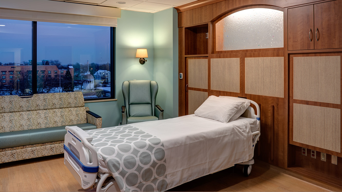 Each of the 72 private inpatient rooms feature custom headwalls with backlit custom cast-glass and sliding panels to obscure equipment while providing access to medical technology.