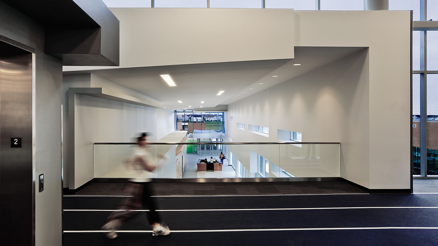 The second floor consists of a jogging track, exercise equipment, and testing area.