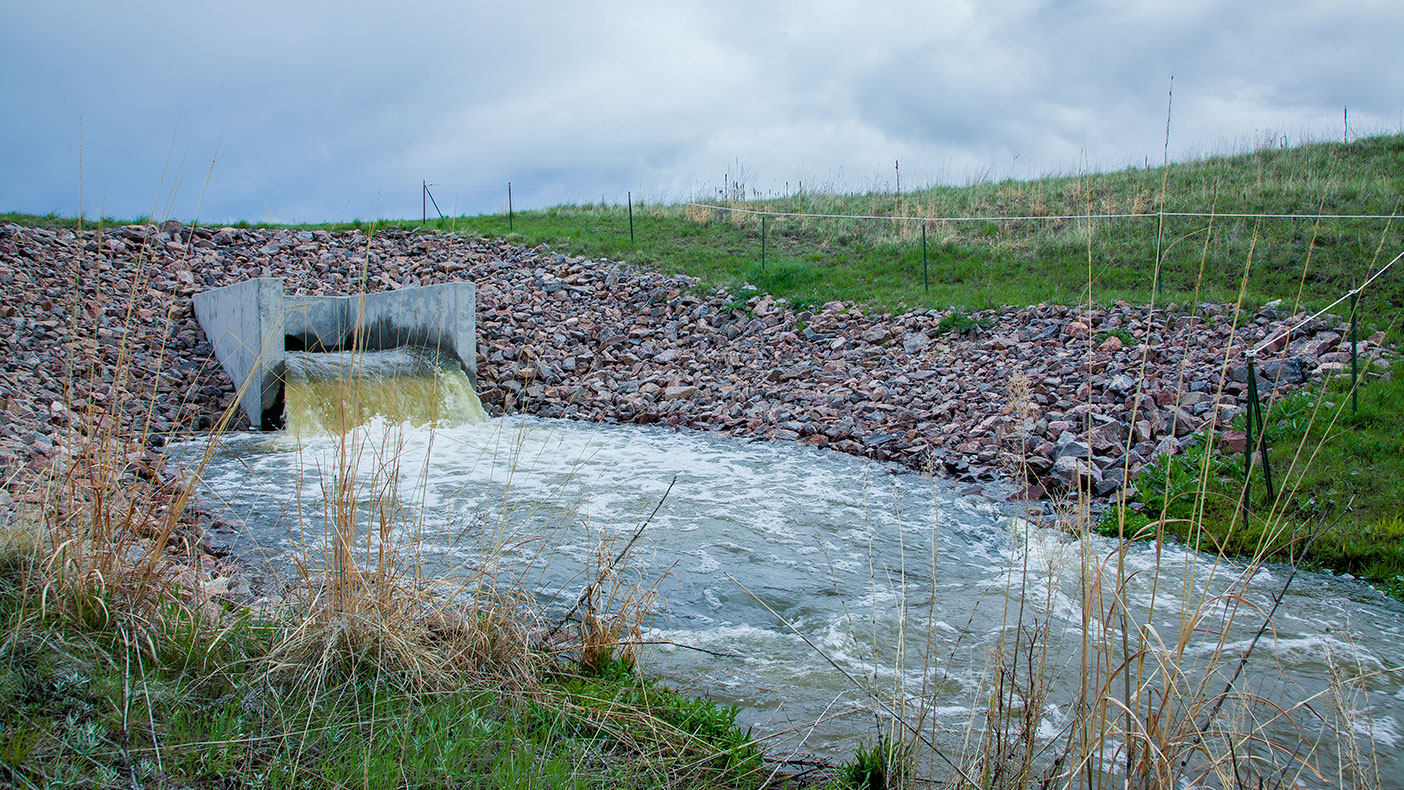 At the end of 15,800 feet of 48-inch welded-steel pipe, more than 32,000 gallons of water per minute are deposited into a stream on the west side of the Rueter-Hess Reservoir.