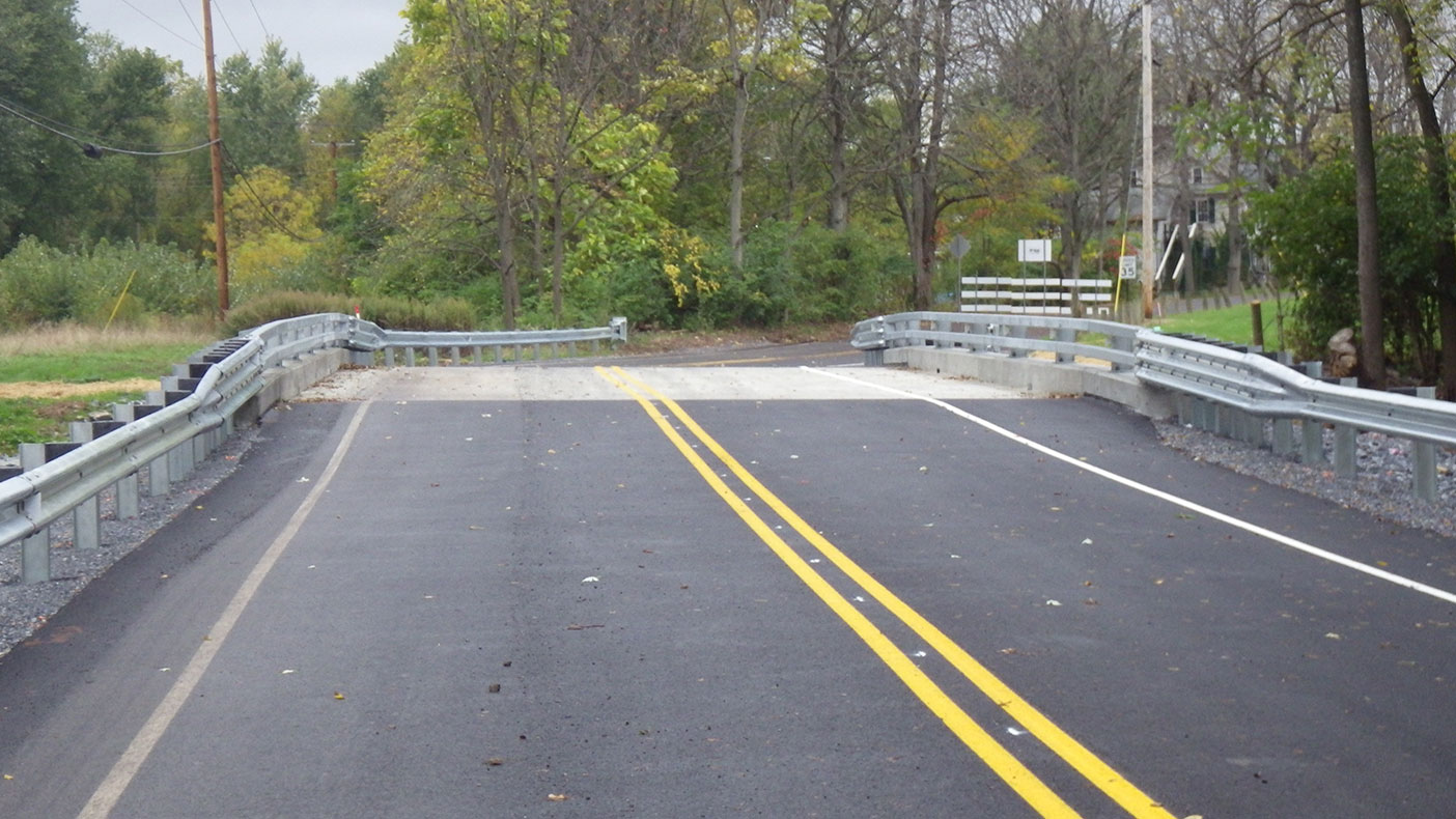 We designed a new bridge consisting of a single-span, adjacent box beam structure located on the existing alignment. 