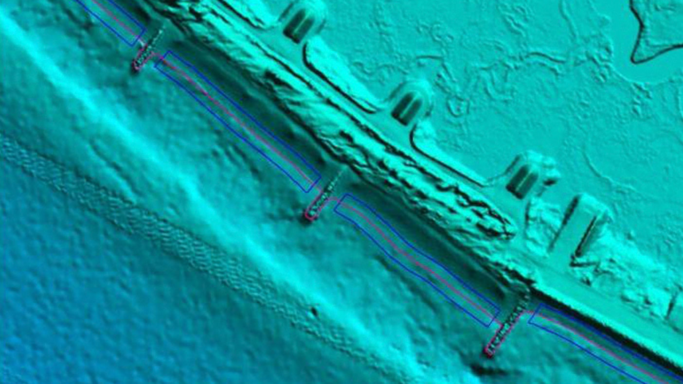 We identified voids and seamlines in the topographic, bathymetric, and acoustic surveys and developed semi-automated techniques to smooth these areas to create a seamless topobathymetric data set.