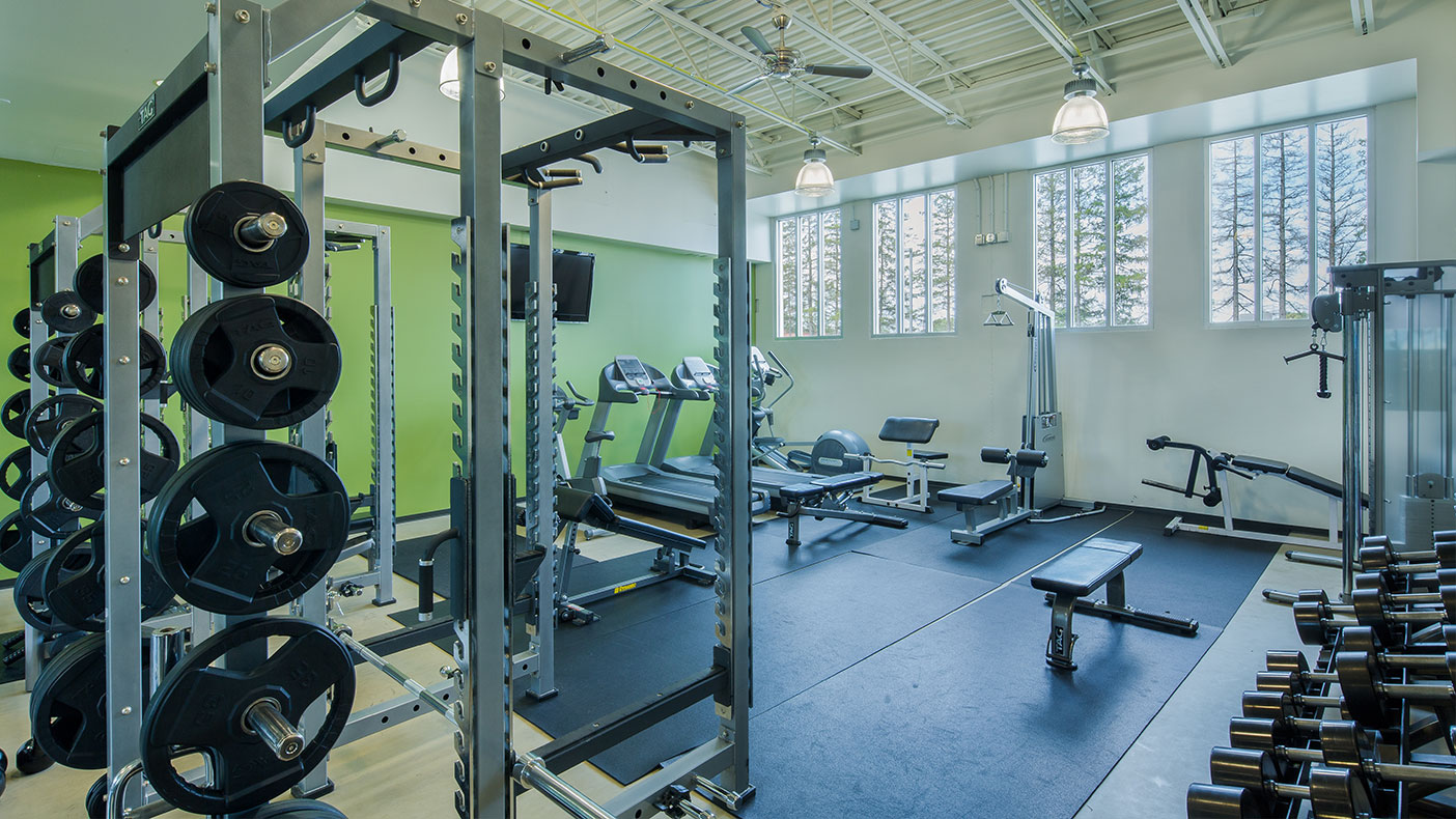 Amenities for staff include a spacious fitness area, showers, and lockers.