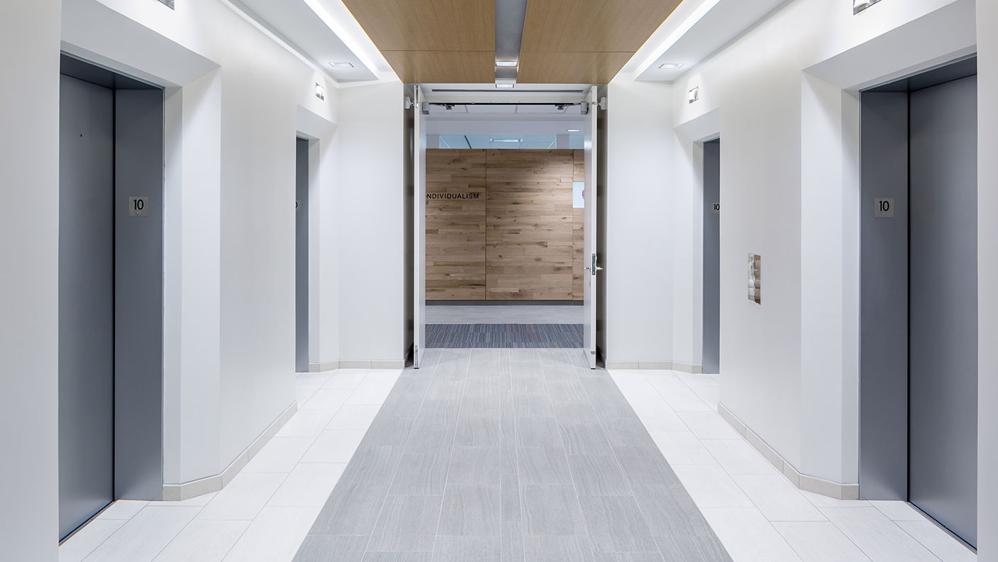 We updated the circa-1980 elevator lobby and restrooms to meet lighting and emergency exit requirements. 