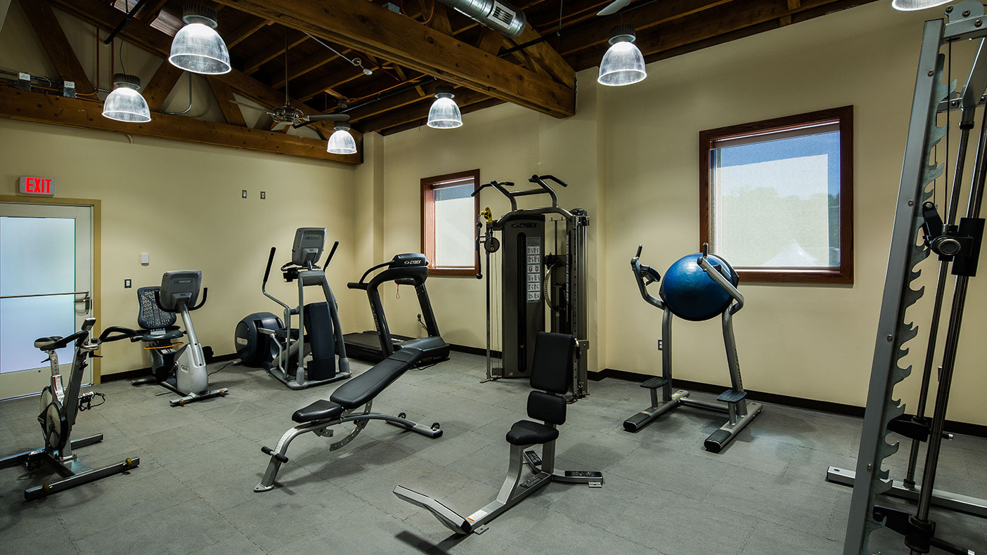 The facility includes an athletic training room for the staff with a variety of aerobic and weight training equipment.