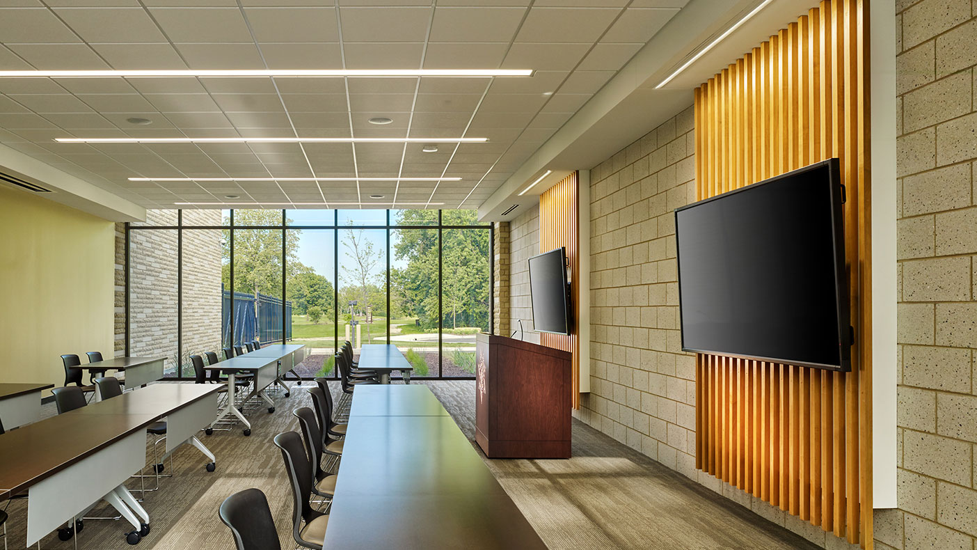 The first floor community room serves as a meeting space for local community organizations with direct views out to a neighborhood park.