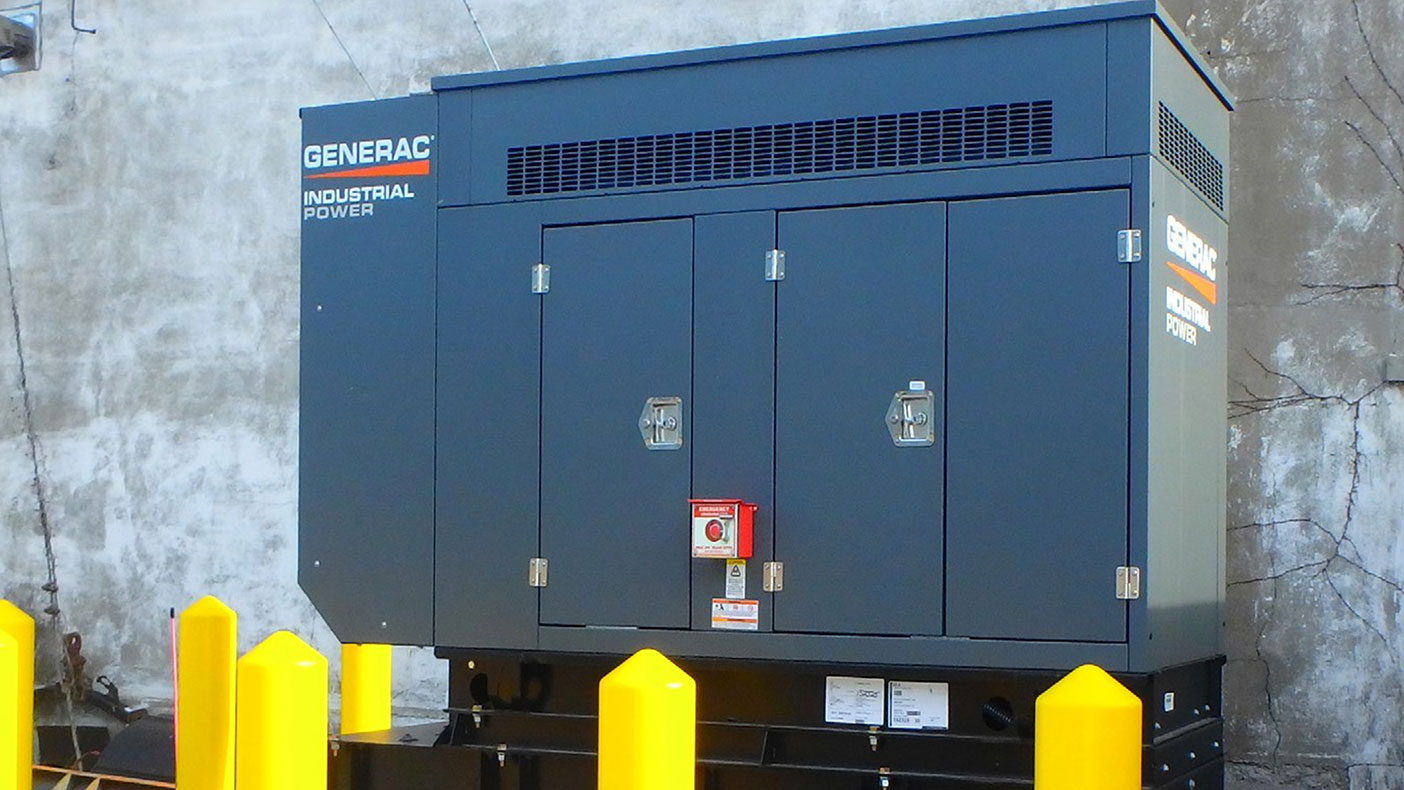 The town hall standby generator is on an outdoor sound attenuated enclosure on a concrete pad with a base mounted UL listed double wall diesel fuel storage tank. 