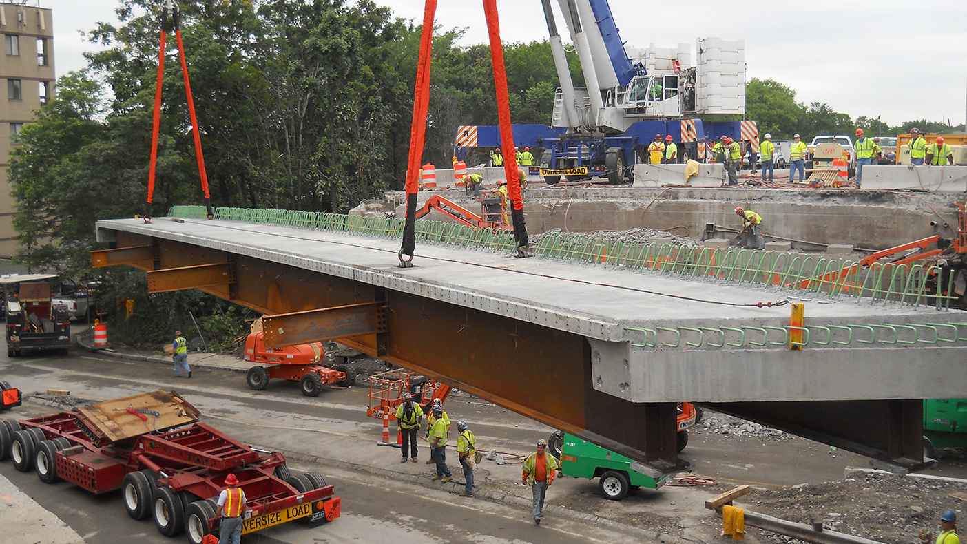 Modular units with two steel girders and a precast concrete deck were fabricated off-site to minimize the on-site work.