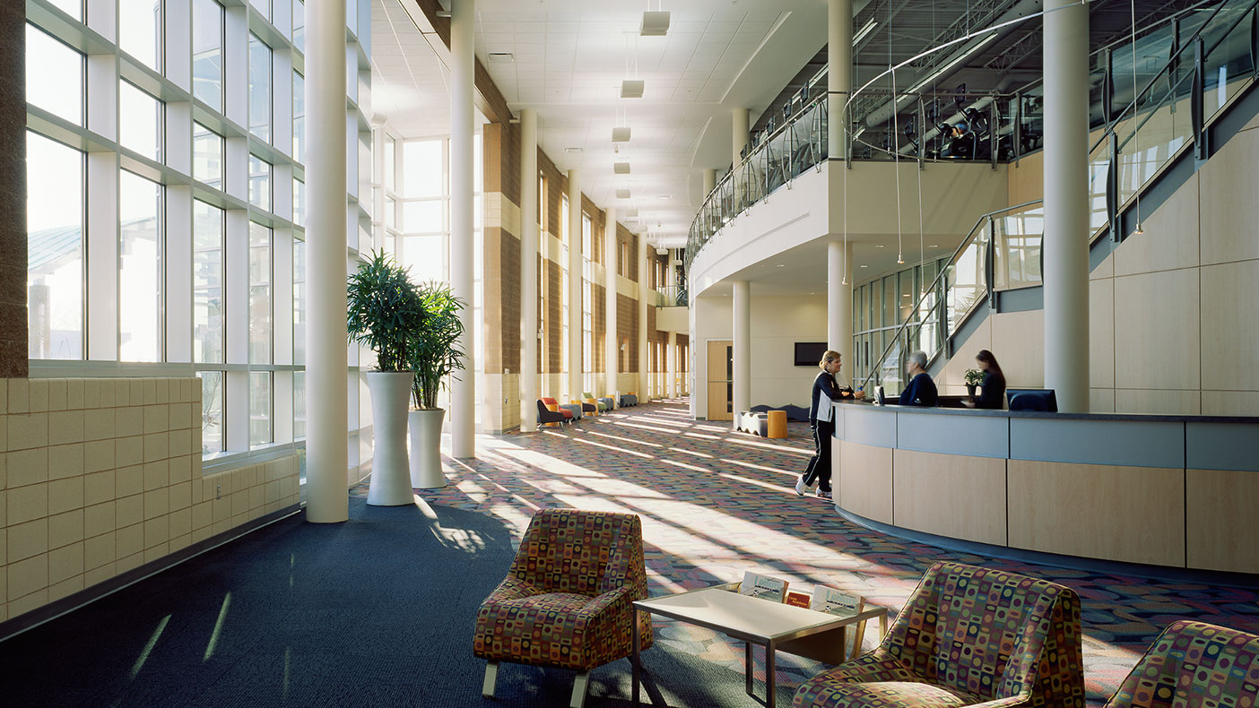 Natural light is provided from a number of locations, including this floor-to-ceiling array of windows at the main entrance. 