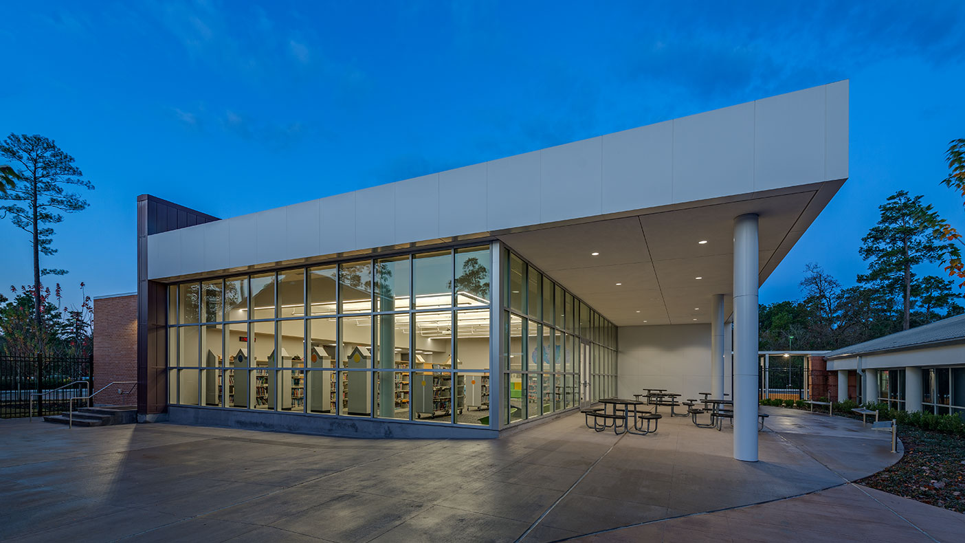 The new library features a full-height glass curtain wall system that takes advantage of natural light from the north.