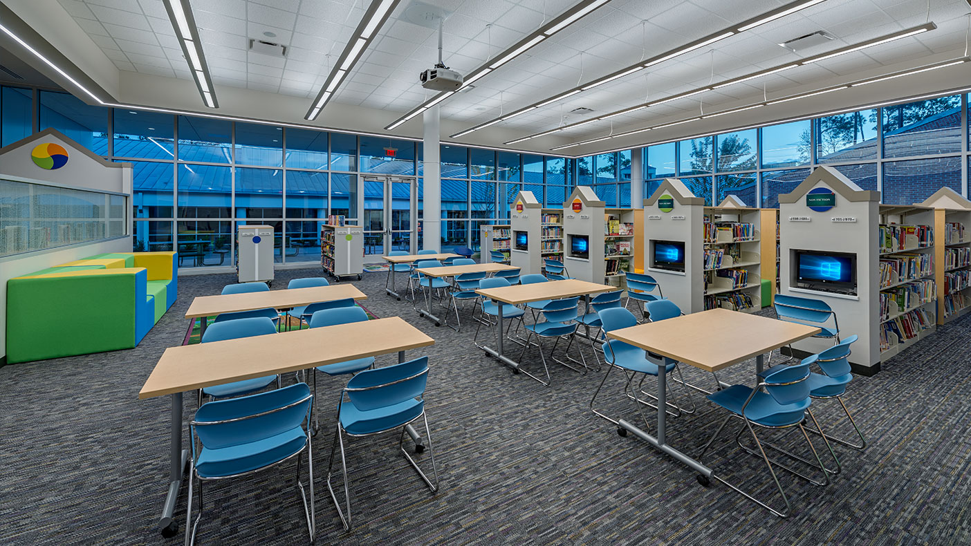 Book shelves were oriented with computers at the ends allowing the librarian to monitor computer usage and see down the aisles from the circulation desk.