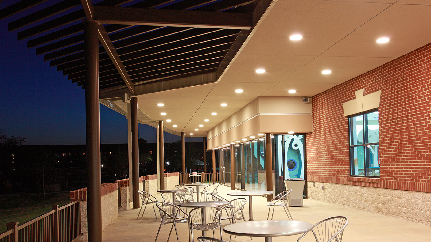 Extending over the glass boxes, overlooking the park, is a canopy to create a covered porch area—enjoyed by patrons year-round.