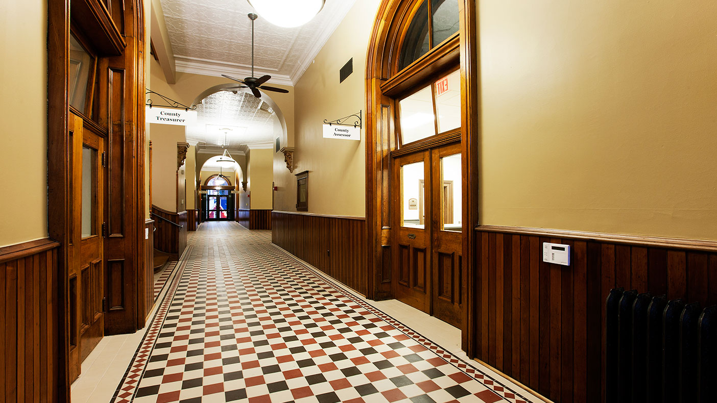 First floor improvements included new ceramic tile, replacing aluminum doors with the original wood doors that were found in a nearby barn, and restoring the woodwork to its original finish.