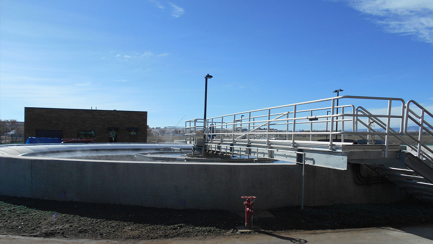 The WWTP improvements included a new secondary clarifier with launder cover to reduce algae growth.