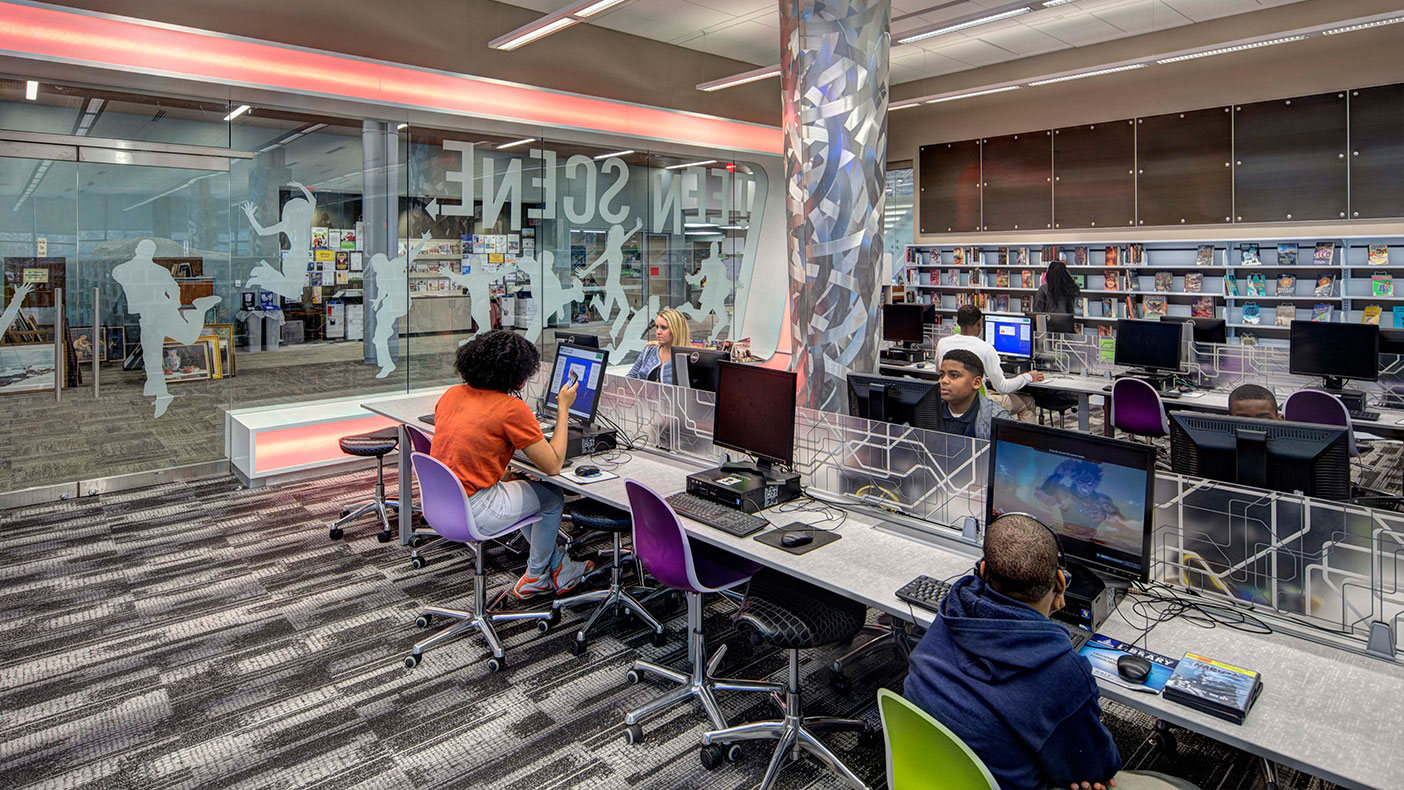 The Teen Scene area of the library allows for engagement through technology, offering a computer lab and media library, and modern designs.