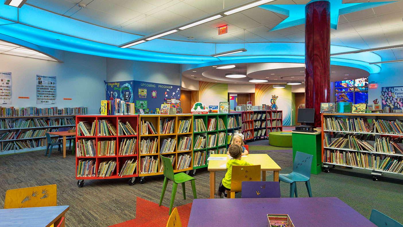 Our warm interior environment adds a playfulness to the children's section of the library, inviting new readers to join in on the fun.