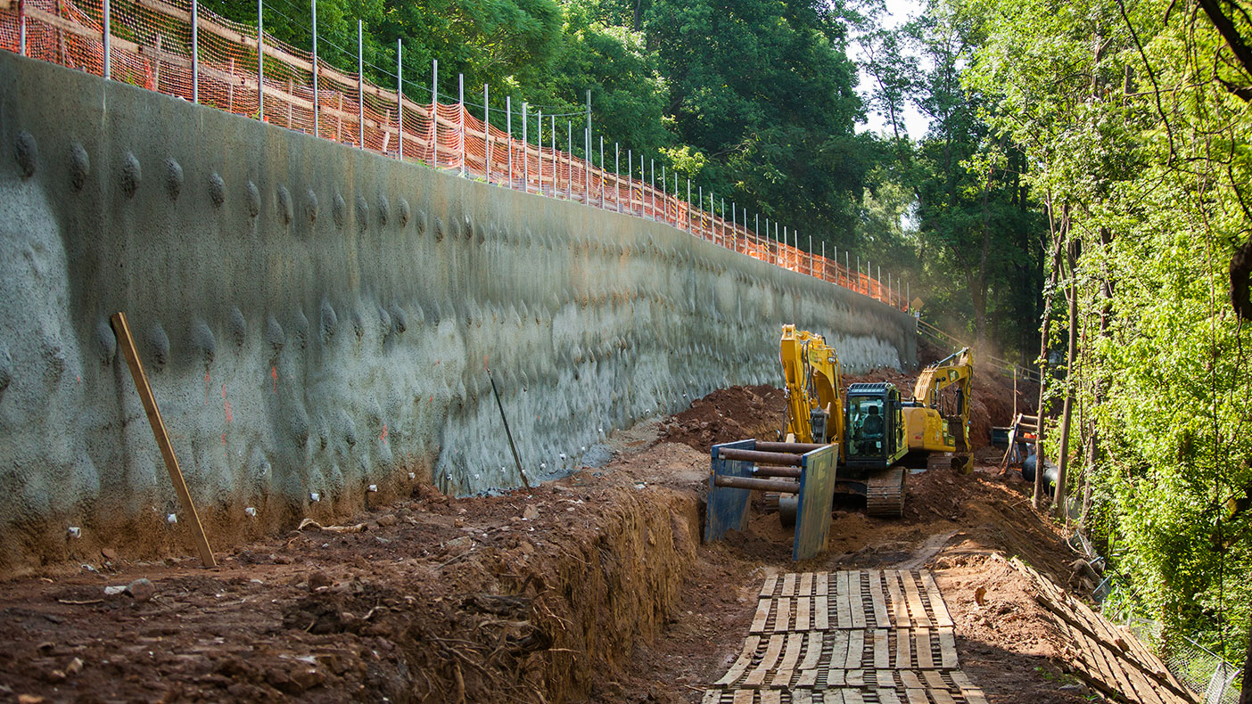 Set on a severe slope, the project required the design and construction of a major retaining wall to allow for safe excavation, protection to a major gas line, and upgradient roadway and railroad.