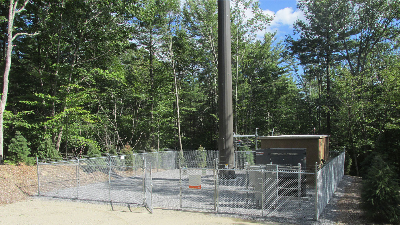 We designed a gravel access road to ease service flow into and out of the tower, secured within a fenced compound.