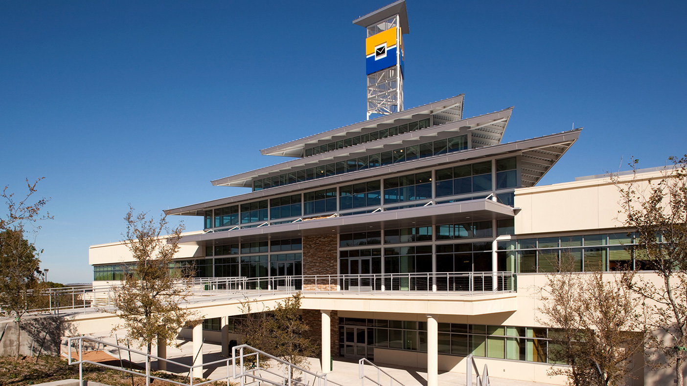 The 88-foot logo tower serves as an iconic structure on the 300-acre wooded site, visible to students and passing motorists.