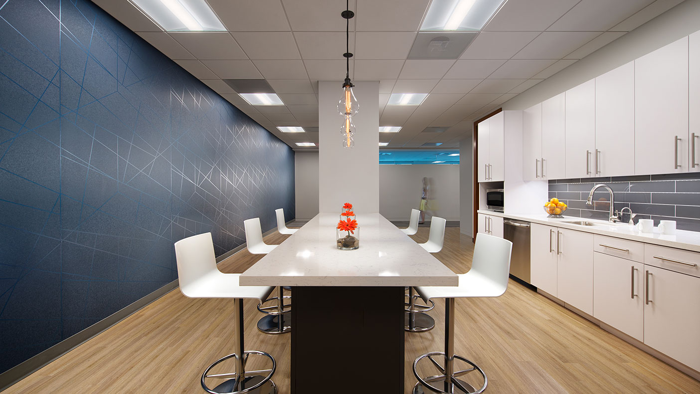 The break area provides employees with a casual corporate environment that promotes collaboration. 