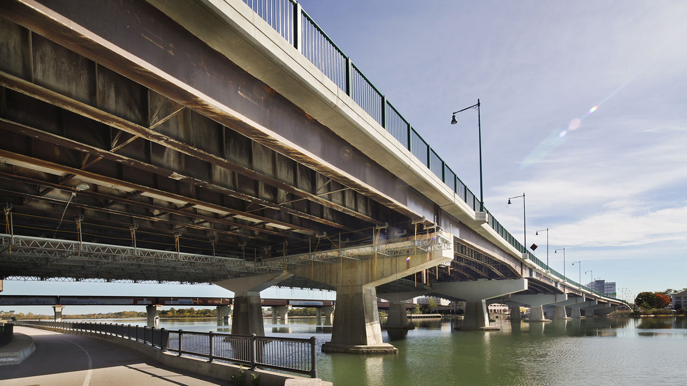 The severely deteriorated piers caps were entirely reconstructed from below while maintaining traffic on the open roadway above.