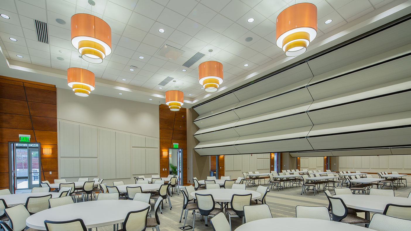 A popular event space for the community, NCI transitions its rooms from academic use to community engagement through seamless design elements.