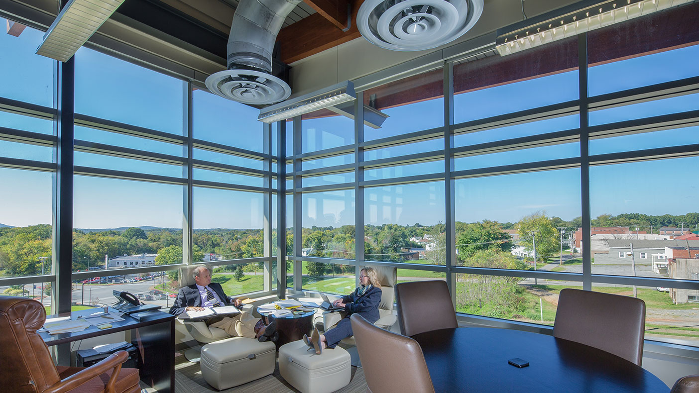 Students, faculty, and community members congregate in the upstairs lounge as they take in the inviting views of the Martinsville skyline.