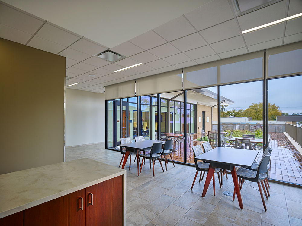 Shared break area with view of the green roof and terrace. Photo by Mariusz Mizera, courtesy of Dewberry.