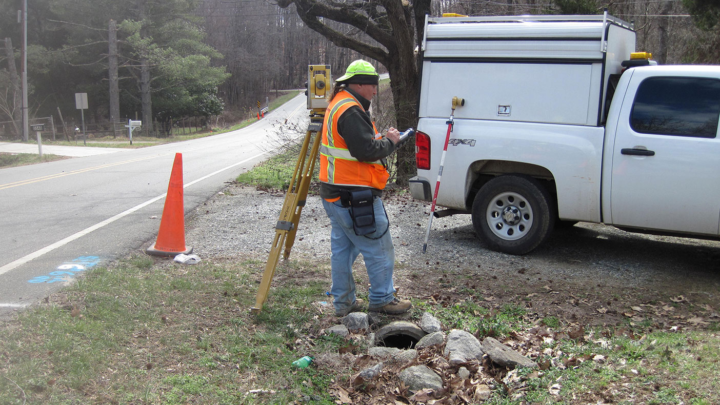 In addition to performing courthouse research and manning traffic control signage, surveyors also compute property and roadway lines.