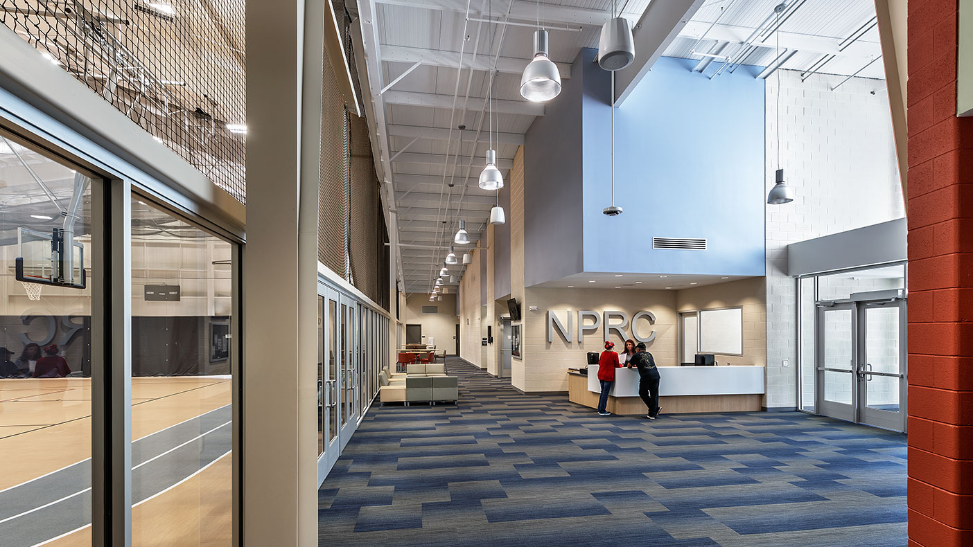 The space provides ample viewing areas, restrooms, and multipurpose spaces adjacent to the control desk at the entrance.