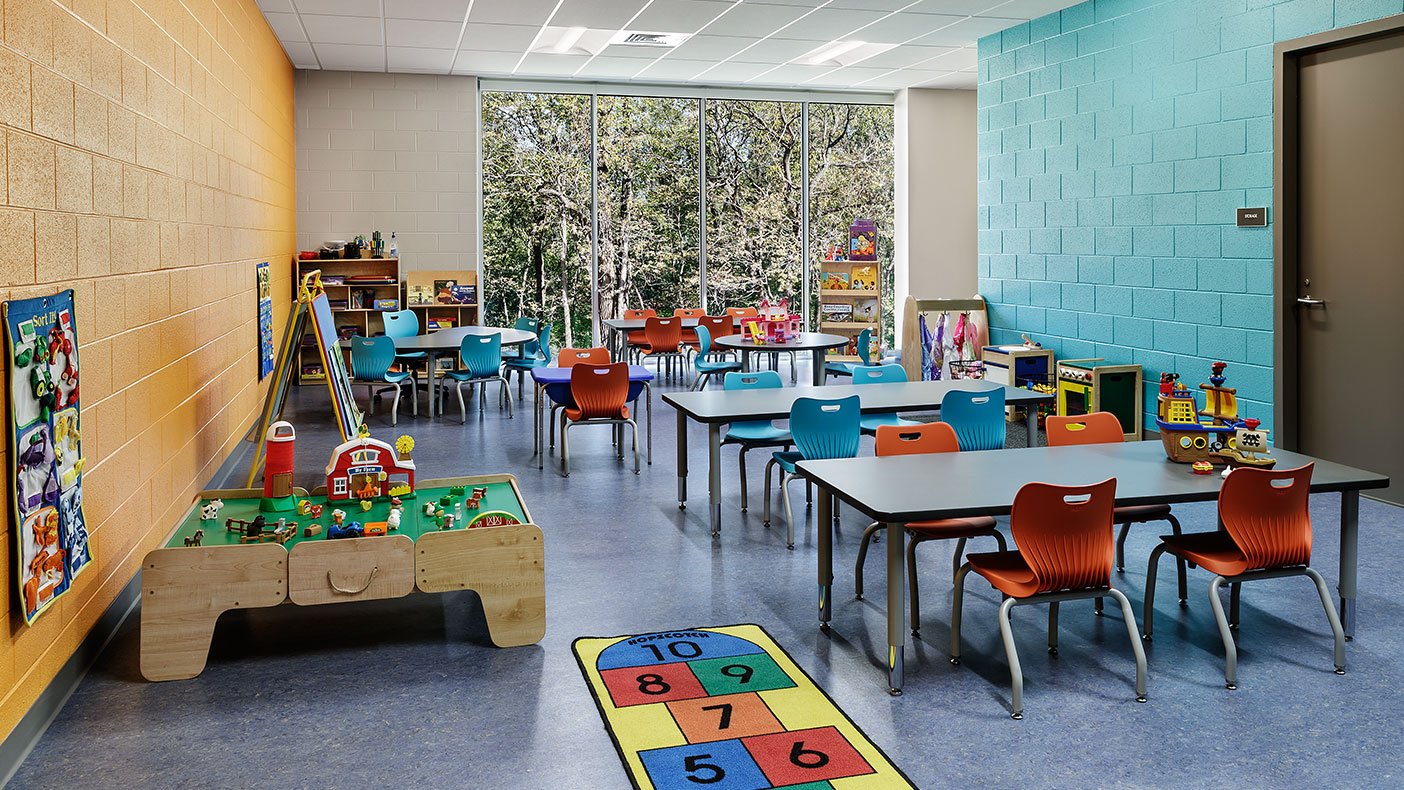 The preschool room includes children’s storage cubbies, a storage room, a sink with base and wall cabinets, and restroom. 
