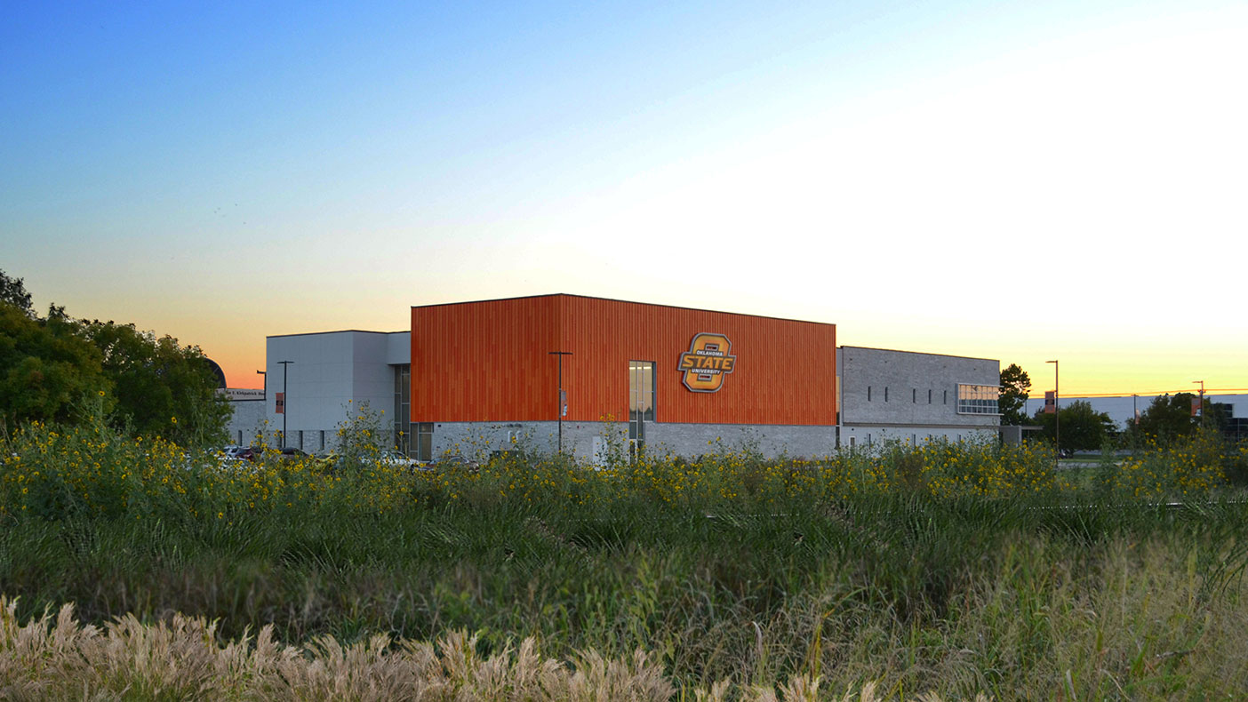 The OSU-branded orange panel creates visibility to the I-40 corridor.