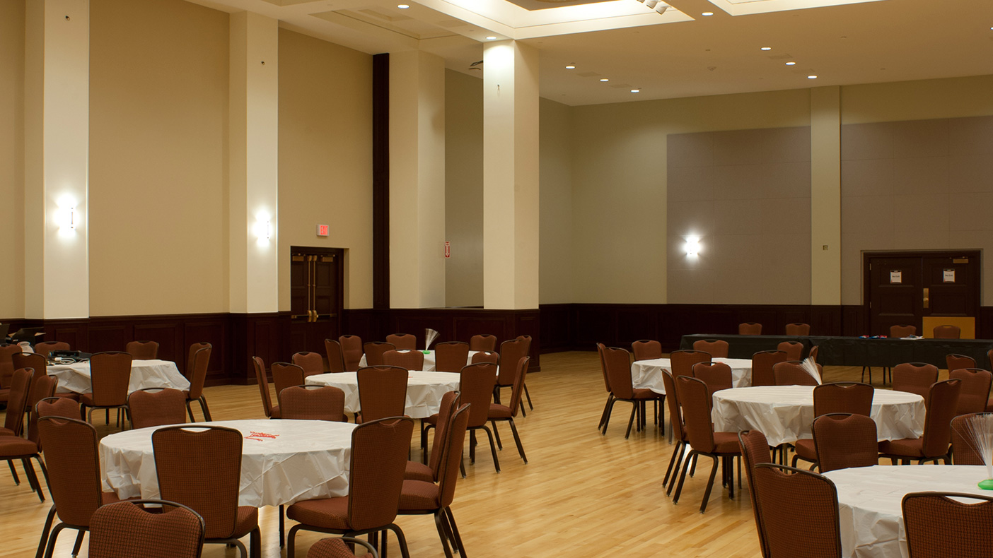 We renovated the historic ballroom by replacing the maple wood flooring; refinishing wood wainscot and trims; and incorporating custom lighting, new sound and sprinkler systems, acoustical wall systems, and three large projection screens.